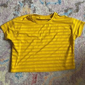 Lululemon yellow mesh cropped shirt.